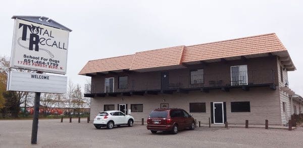 Dog training school exterior with parked cars